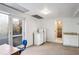 Spacious bonus room with carpet flooring, a kitchenette, and outdoor access at 3073 Henderson Mill Rd, Atlanta, GA 30341