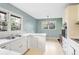 Bright kitchen with white cabinetry, stainless steel sink, and view to dining area at 3073 Henderson Mill Rd, Atlanta, GA 30341