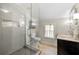 Updated bathroom with a glass shower, modern vanity, and neutral finishes at 3097 Sycamore Ln, Marietta, GA 30066