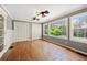 Bedroom featuring hardwood floors, built-in closet, crown molding, and natural light from large windows at 3097 Sycamore Ln, Marietta, GA 30066