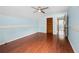 Bedroom with natural light, ceiling fan, and lustrous hardwood floors at 3097 Sycamore Ln, Marietta, GA 30066