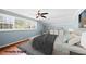 Cozy staged bedroom with a ceiling fan, natural light and hardwood floors at 3097 Sycamore Ln, Marietta, GA 30066