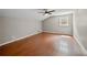 Large bedroom with lustrous hardwood floors, ceiling fan, and a vaulted ceiling at 3097 Sycamore Ln, Marietta, GA 30066