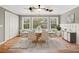 Dining room featuring hardwood floors, neutral walls, and a stylish table set for six guests at 3097 Sycamore Ln, Marietta, GA 30066