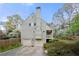 Rear exterior view of home, featuring a two-car garage and wooded lot at 3097 Sycamore Ln, Marietta, GA 30066