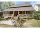 Charming exterior featuring a cozy front porch and manicured front yard at 3097 Sycamore Ln, Marietta, GA 30066