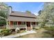 Charming home with a welcoming front porch and well-maintained landscaping at 3097 Sycamore Ln, Marietta, GA 30066