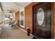 Inviting front porch with seating, wood ceiling and a stained front door at 3097 Sycamore Ln, Marietta, GA 30066