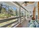 Spacious covered porch with comfortable seating and a scenic view at 3097 Sycamore Ln, Marietta, GA 30066