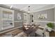 Bright home office featuring hardwood floors, wainscoting, crown molding, and a built-in desk at 3097 Sycamore Ln, Marietta, GA 30066