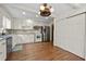 Kitchen featuring white cabinets, stainless steel appliances, hardwood floors, and plenty of storage space at 3097 Sycamore Ln, Marietta, GA 30066