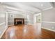 Open-concept living room with fireplace, hardwood floors, and ample natural light at 3097 Sycamore Ln, Marietta, GA 30066