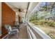 Relaxing porch with ceiling fan, wicker furniture, and beautiful views at 3097 Sycamore Ln, Marietta, GA 30066