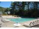 A community swimming pool surrounded by lounge chairs and trees at 3097 Sycamore Ln, Marietta, GA 30066