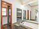 Beautiful bathroom with a stand up shower and a soaking tub with a large mirror above it at 3684 Wittenburg Ct, Decatur, GA 30034