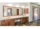 Large bathroom featuring double sinks, a spacious vanity, and large mirror at 3684 Wittenburg Ct, Decatur, GA 30034
