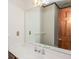 Bathroom featuring white counters, a large mirror and wood trim around the door at 3684 Wittenburg Ct, Decatur, GA 30034