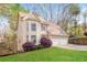 Charming home with a two-car garage, bay window, manicured lawn, and mature trees at 3684 Wittenburg Ct, Decatur, GA 30034