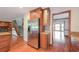 Kitchen area with stainless appliances, hardwood floors, and view to stairwell, Gathering room, and living room at 3684 Wittenburg Ct, Decatur, GA 30034