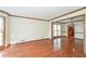 Open living area with hardwood floors and view to dining area and modern kitchen at 3684 Wittenburg Ct, Decatur, GA 30034