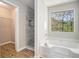 Luxurious bathroom featuring a soaking tub and tiled walk-in shower at 4490 Thornwood Trl, Stone Mountain, GA 30083