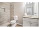 Updated bathroom featuring a tiled walk-in shower and modern vanity at 4490 Thornwood Trl, Stone Mountain, GA 30083