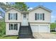 Charming two-story home with a welcoming front porch and two-car garage at 4490 Thornwood Trl, Stone Mountain, GA 30083