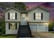 Charming two-story home with a welcoming front porch and two-car garage at 4490 Thornwood Trl, Stone Mountain, GA 30083