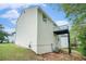 Back exterior view of home with siding and a walk-out deck at 4490 Thornwood Trl, Stone Mountain, GA 30083