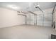 Spacious garage with two doors, painted floors and overhead lighting at 4490 Thornwood Trl, Stone Mountain, GA 30083