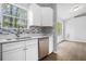 Modern kitchen with white cabinets, stainless steel appliances and mosaic tile backsplash at 4490 Thornwood Trl, Stone Mountain, GA 30083