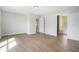 Spacious bedroom with wood floors and doors to bathroom and walk-in closet at 4490 Thornwood Trl, Stone Mountain, GA 30083