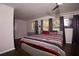 Bedroom with dark wood floors, windows with drapes and a modern ceiling fan at 819 Venetta Nw Pl, Atlanta, GA 30318
