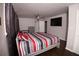 Bedroom with dark wood floors, windows with drapes and a modern ceiling fan at 819 Venetta Nw Pl, Atlanta, GA 30318