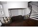 Staircase and entryway showcases hardwood flooring, decorative iron railings, and ample natural light at 819 Venetta Nw Pl, Atlanta, GA 30318