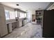 Spacious kitchen with marble tile flooring, stainless steel appliances, and modern white cabinetry at 819 Venetta Nw Pl, Atlanta, GA 30318