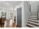 Hallway that shows the dining room, front door and staircase at 1895 Weston Ln, Tucker, GA 30084