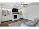 Bright living room featuring coffered ceilings and a white brick fireplace at 1895 Weston Ln, Tucker, GA 30084