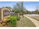 Community entrance with stone signage and well-maintained landscaping at 1895 Weston Ln, Tucker, GA 30084