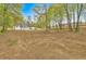 Expansive back yard featuring abundant space and treed perimeter of property at 484 Lorene Sw Dr, Marietta, GA 30060