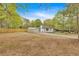Charming single-story home with a spacious front yard, storage shed, fenced yard, and a long driveway at 484 Lorene Sw Dr, Marietta, GA 30060