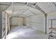 The interior of a metal framed garage, workshop, or storage shed at 484 Lorene Sw Dr, Marietta, GA 30060