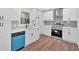 Beautiful updated kitchen with white cabinets, stainless steel appliances, and modern countertops at 484 Lorene Sw Dr, Marietta, GA 30060