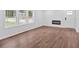 Bright living room with hardwood floors, a modern electric fireplace, and large windows at 484 Lorene Sw Dr, Marietta, GA 30060