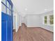 Bright living room boasts newly installed wood flooring and ample natural light from windows at 484 Lorene Sw Dr, Marietta, GA 30060