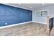 Stylish bedroom with custom wall decor, hardwood floors, and a large window for natural light at 921 Creekdale Dr, Clarkston, GA 30021