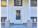 Close-up of the home's front door, framed by elegant columns and the house number 921 at 921 Creekdale Dr, Clarkston, GA 30021