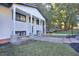 Charming home featuring a well-maintained front yard with landscaped walkway and a welcoming covered porch at 921 Creekdale Dr, Clarkston, GA 30021