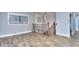 Upstairs landing with hardwood floors, windows, decorative wrought iron railing and modern lighting at 921 Creekdale Dr, Clarkston, GA 30021