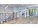 Spacious living area with hardwood floors, an open floor plan, and sliding doors to a private balcony at 921 Creekdale Dr, Clarkston, GA 30021